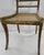 The woodwork on this side chair is outstanding. From the scalloped and swirled back to the cane bottom seat, it catches...