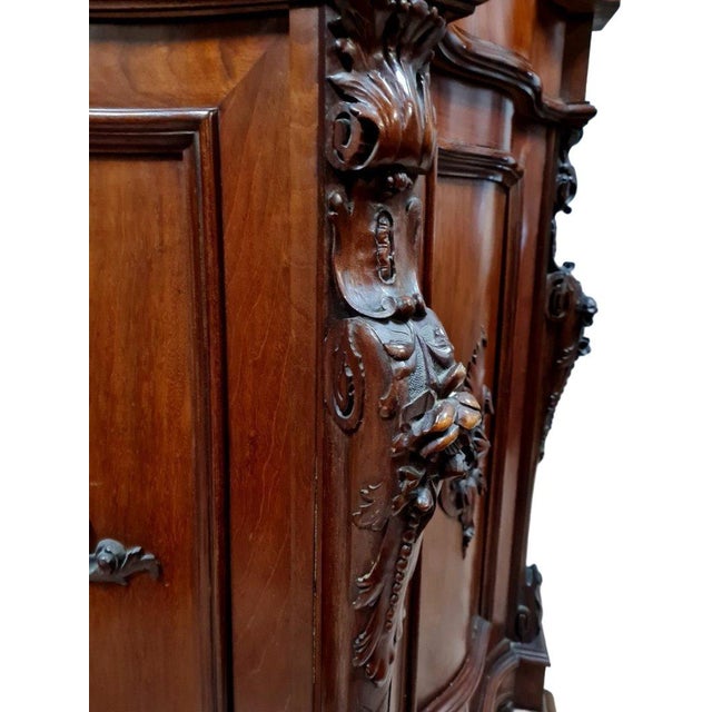 Napoleon iii period mahogany sideboard with curved sides, circa 1850 opening on the front with two doors and two drawers...