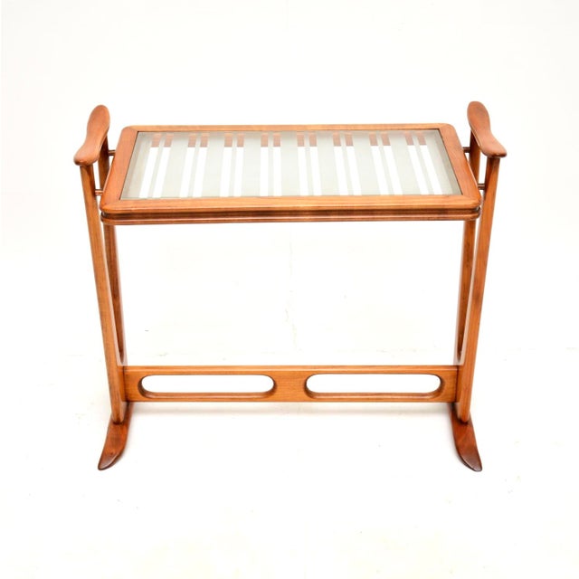 A very stylish and well made vintage French cherry wood glass top side table. This was recently imported from France, it...