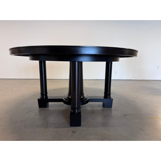 A sculptural round dining table by Christian Liaigre, the French designer known for restrained, luxurious modernism, made...
