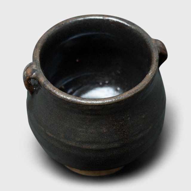 This petite glazed jar from China's Shanxi province exemplifies the timeless appeal of handcrafted pottery. Once used in...