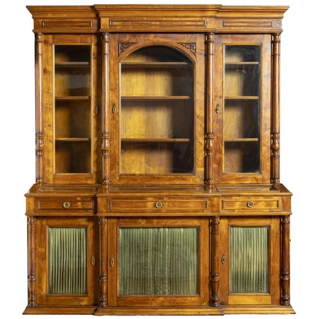 BOOKCASE Portuguese, 19th century, made of mahogany wood, upper part with three glazed doors and three shelves, resting on...