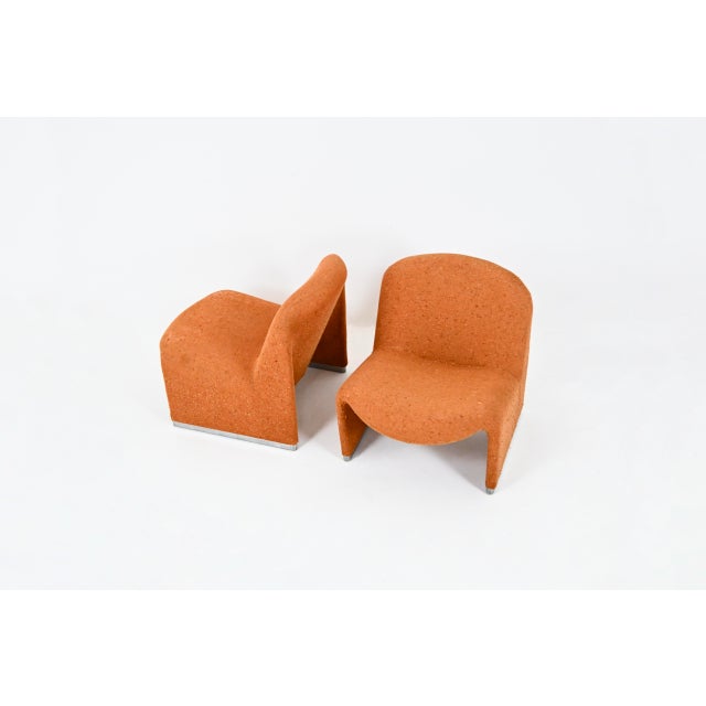Pair of Alky armchairs in original orange fabric. Seat height: 38cm. Castelli labels. Wear due to time and age. This piece...
