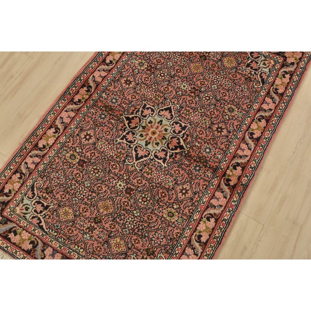 An authentic vintage traditional Bidjar rug hand-knotted with fine wool and natural dyes. This oriental rug features a...