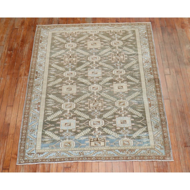 An early 20th century Persian Malayer rug in earth colors