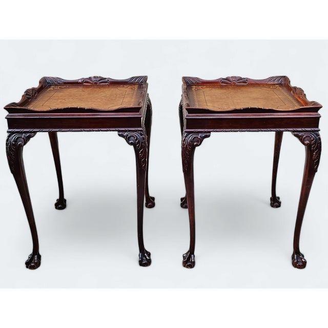 This Pair of Superior [Kindel] Mahogany Chippendale Style Leather-Top Ball and Claw End Tables embodies the allure of...