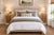 A charming matching pair of vintage handmade solid-wood nightstands featuring compact proportions, warm natural wood...