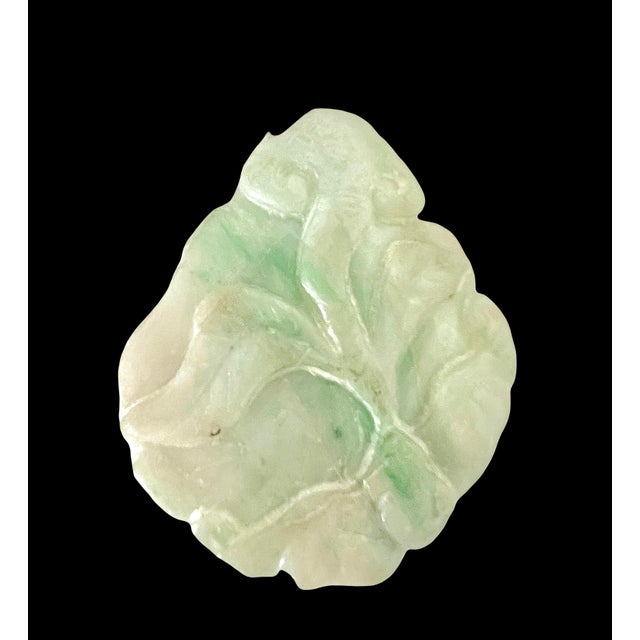 Pretty hand carved green and white jade plaque that can be used as a pendant. Depicts the Chinese 'Sleeping Dragon'...