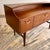 A refined vintage Danish modern style dressing table or lowboy dresser distinguished by its graceful curved gallery top,...