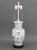 Chinese Famille Rose Porcelain Vase Mounted as a Table Lamp, mounted on an ebonized wood base. 29.75" H x 8.5" Diameter....