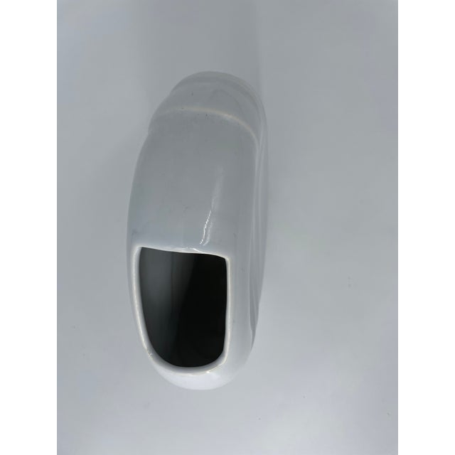 Vintage postmodern circular white vase by Haeger. Depending on what angle it is in the light, you can see iridescent...