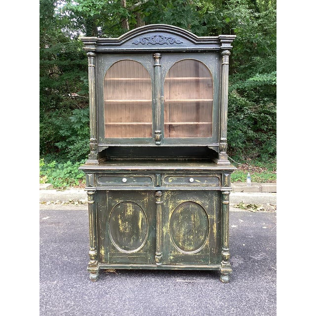 A striking antique two-piece painted pine hutch cabinet featuring classic Gustavian and Scandinavian provincial...