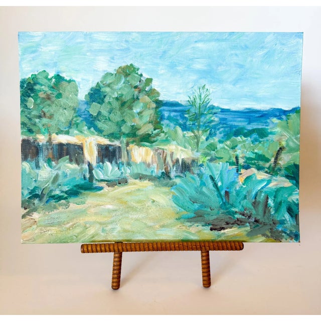 A lovely cool blues desert painting depicting an adobe structure hidden by trees and agave or yucca plants. The brush...