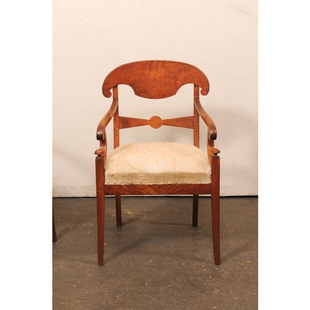 A handsome pair of Swedish Empire armchairs from the early 19th century. These antique Empire period chairs from Sweden,...