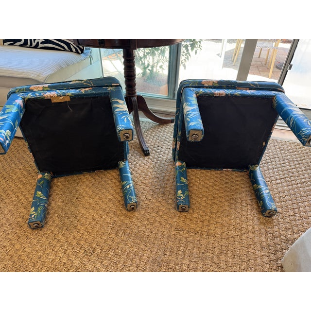 A lovely pair of fully upholstered Parsons-style ottomans in a slate blue chinoiserie fabric featuring cranes, flowering...