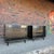 This pair of chest drawers by American of Martinsville are black painted wood with white vinyl tops. The drawer pulls are...