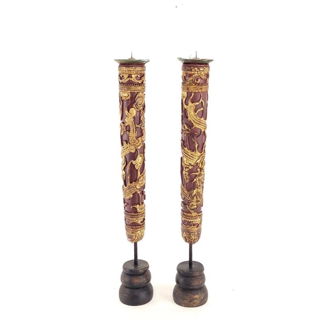 A rare pair of Chinese giltwood candle stands, circa 1830.