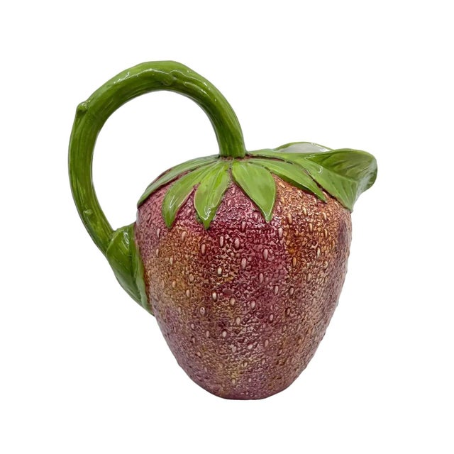 Mid century strawberry pitcher made in Italy . The pitcher is textured and made beautifully. Hand painted. Craftsmanship...