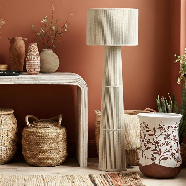 The Tapered Natural Chenille Fiber Floor Lamp brings a soft, grounded presence to the room. Wrapped in plush chenille...