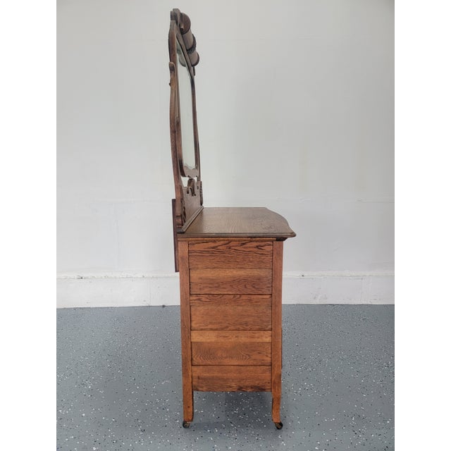 Offered here is one piece from a long-preserved American quarter-sawn tiger oak bedroom suite dating to approximately...