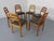 Set of 6 dining chairs in solid teak by Dyrlund. The seats are upholstered in black leather. This piece has an attribution...