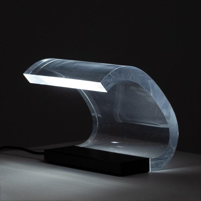 The Acrilica 281 table lamp, designed by Joe Colombo in collaboration with his brother Gianni Colombo for Oluce in 1962,...