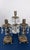A commanding three-piece arrangement of Hollywood Regency girandoles. The centerpiece features tiered glass prisms draped...