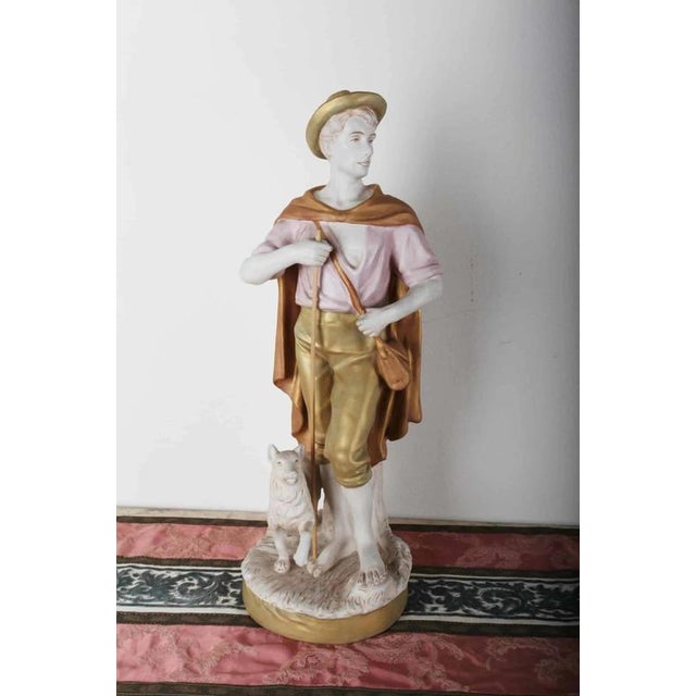Hand-painted Royal Dux statues with pink triangular sticker and brand. The trademark "Royal Dux Bahemia D" is among the...