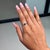 This elegant Promise Ring showcases a 0.5 carat natural heart-cut emerald, set in 18k white gold. The center stone...