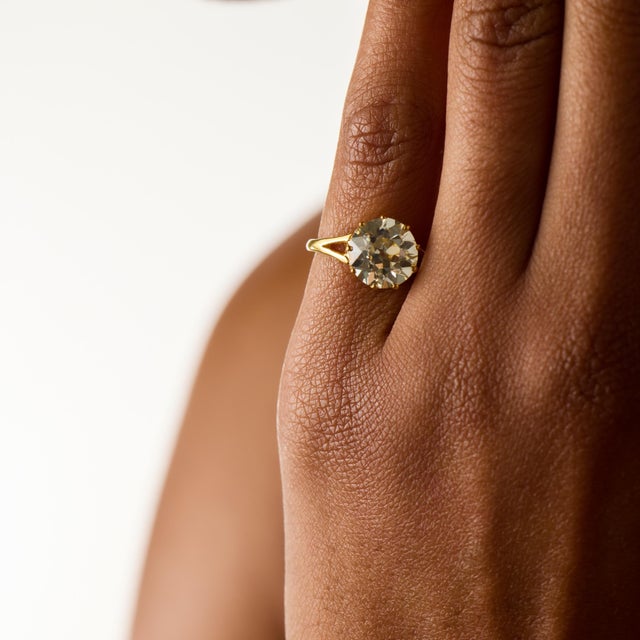 This remarkable antique engagement ring centers on a 3.55 carat old European cut diamond, certified by GIA #5232879390,...