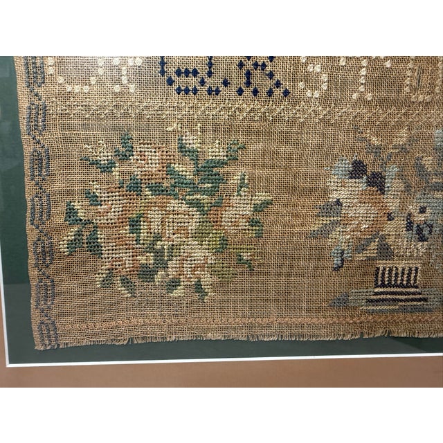 Up for sale is a large antique early 19th century handmade needlepoint sampler. The sampler is done with elaborate...