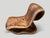 Impressive one of a kind chair made from a single piece of suar wood and carved seamlessly from one piece of wood. We...