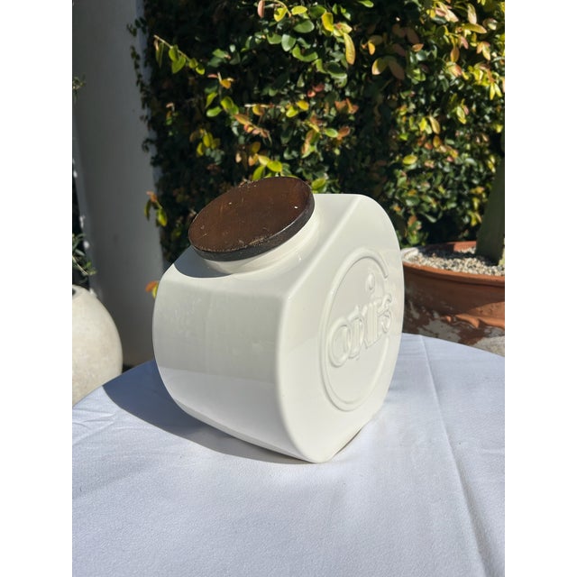 Vintage mid-century ceramic cookie jar with sculptural form and fitted lid. A charming functional piece ideal for kitchen...