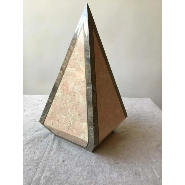 1980s tessellated stone obelisk with brass inlay.