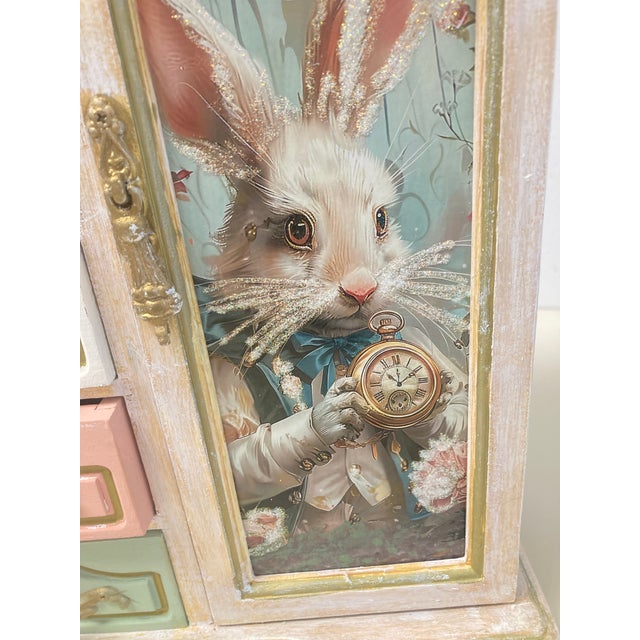One of a kind, hand painted and embellished box in the Alice in Wonderland theme. The white rabbit and a clock are featured.