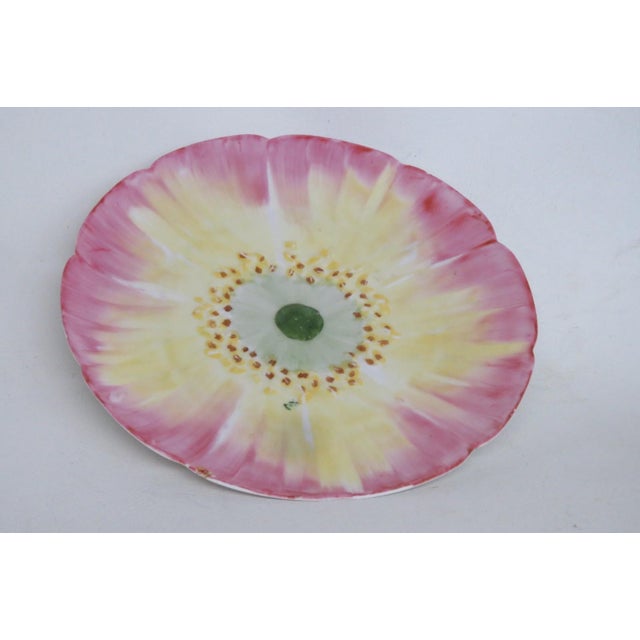 This beautiful Flower Plate is made of porcelain. This stunning antique plate presents the shape and design of a flower...