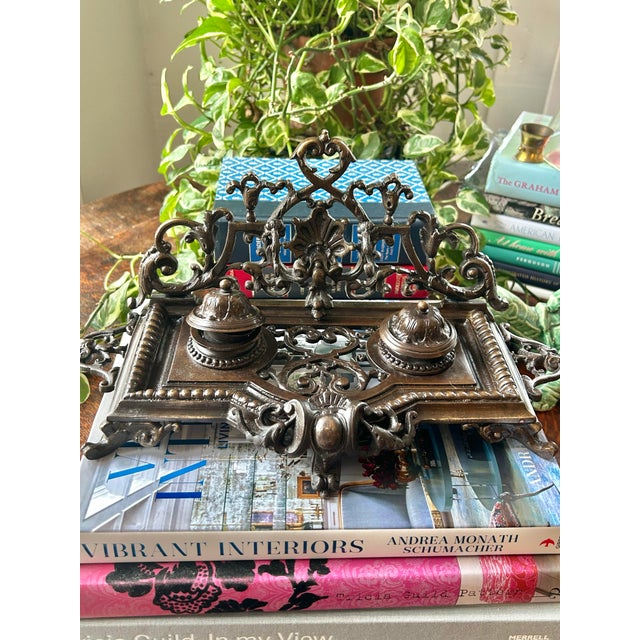 This bronze double ink well is reported to be from the late 1800’s by the previous owner. Rococo Revival in style, it is...