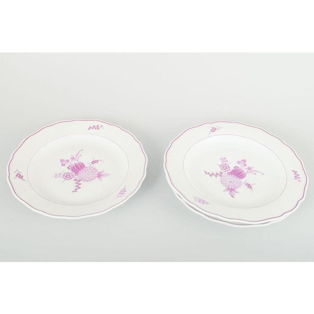 Meissen, Germany 3 dinner plates, 1930s. Set of three hand-painted porcelain dinner plates decorated with lilac floral...