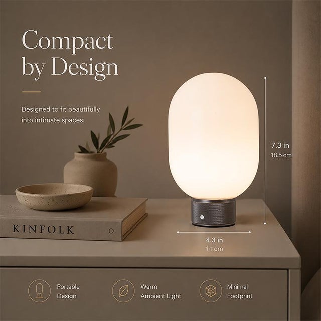 This cordless table lamp features a soft, capsule-inspired silhouette that brings a warm and cozy atmosphere to any space....
