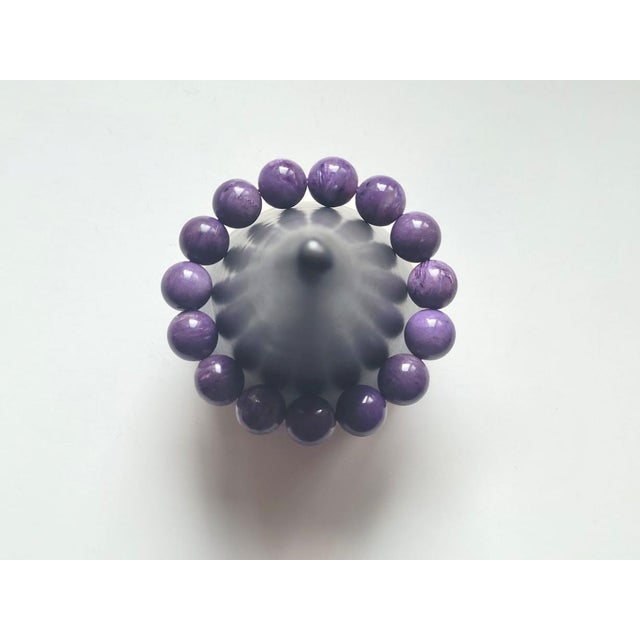 A striking and substantial Charoite bracelet suitable for both men and women. The bracelet measures 9 inches (22.8 cm) in...