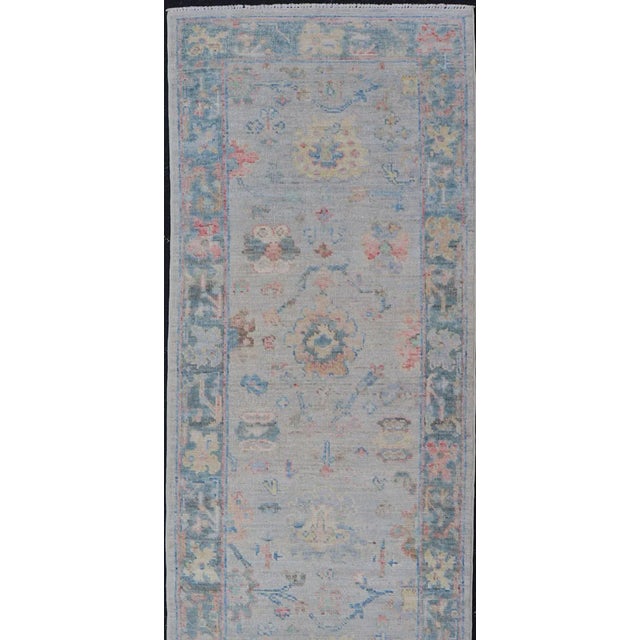 Measures: 2'5 x 9'10 Hand-Knotted Modern Oushak Runner on Light Gray Field and Colorful Motifs. Keivan Woven Arts; rug...