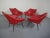 Set of 4 armchairs from the 1960s. Original cover with red imitation leather. Completely new upholstered. Legs in black...