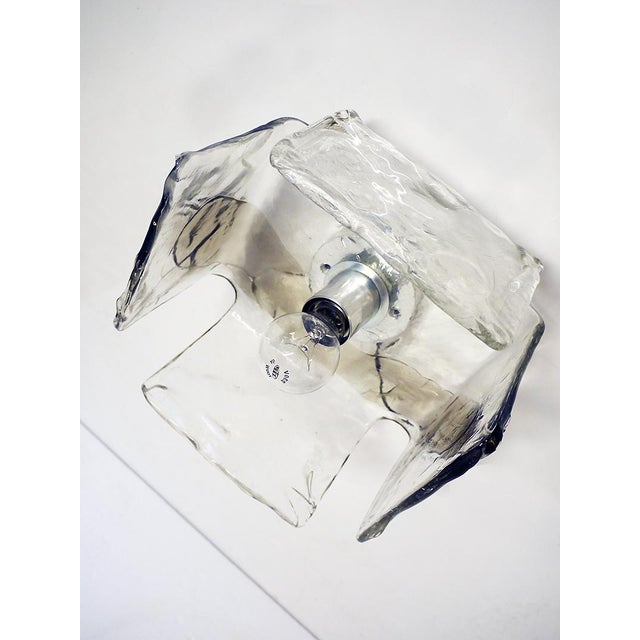 Smokey ice glass wall sconce and ceiling light executed in handblown Murano glass and chrome hardware. Manufactured by...