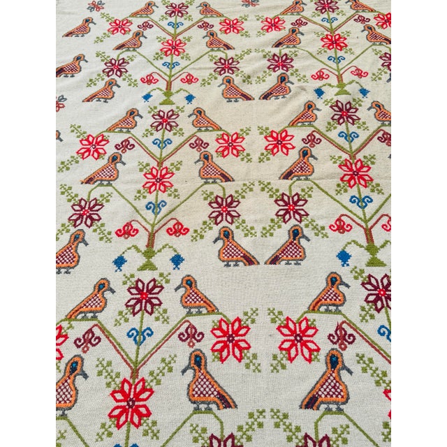 This stunning vintage hand-embroidered folk textile or thin rug features an intricate design of colorful birds, floral...