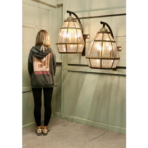 This is an enormous Pair of Octagonal Pyramid Wall Lanterns they are painted in gold so they still look like the brass...