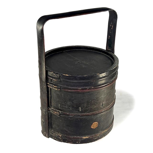 This wooden food box is an antique handmade item from China and dates from around 1890-1920. It has two sections plus lid...