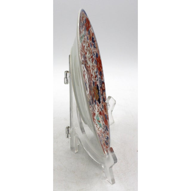 Late 19th century Meiji period Japanese Imari Plate. Extravagantly decorated with butterflies, floral & geometric motifs...