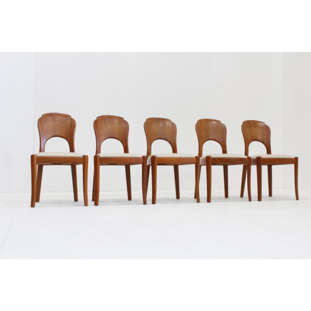 Set of 5 vintage 1960s teak dining room chairs features sculpted Mid-Century Modern frames paired with orignal vintage...