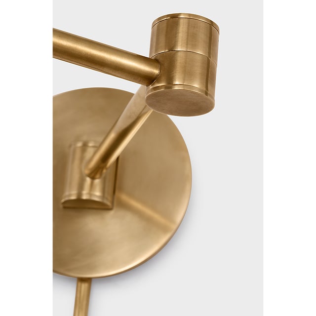 Go Lightly Swing Arm Wall Light in Soft Brass with Linen Shade Designer: Barbara Barry Finish: Soft Brass Height: 15.75"...