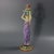 George Jones Majolica candlestick which features a lady dressed in a classical, flowing robe, holding the candle sconce...